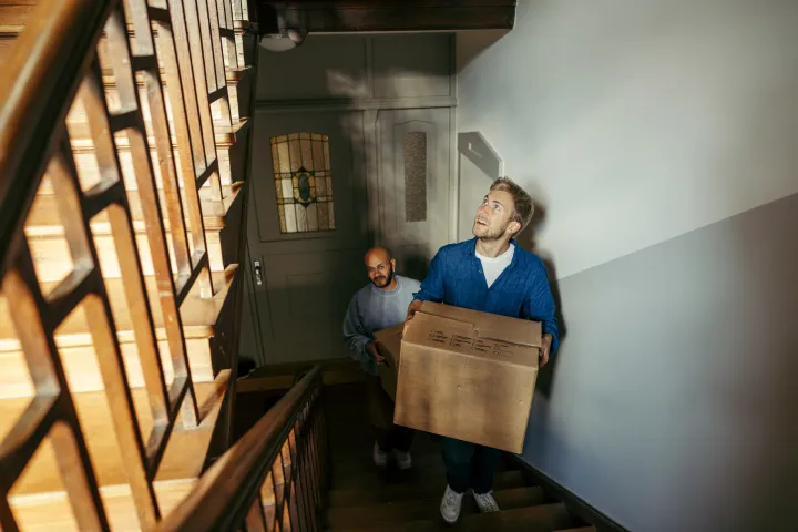 Male renters moving in a new home