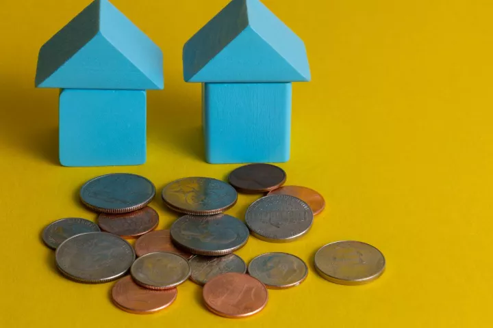 Block houses with coins