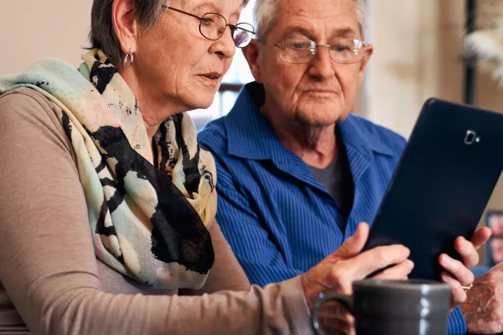 Older couple looking at tablet