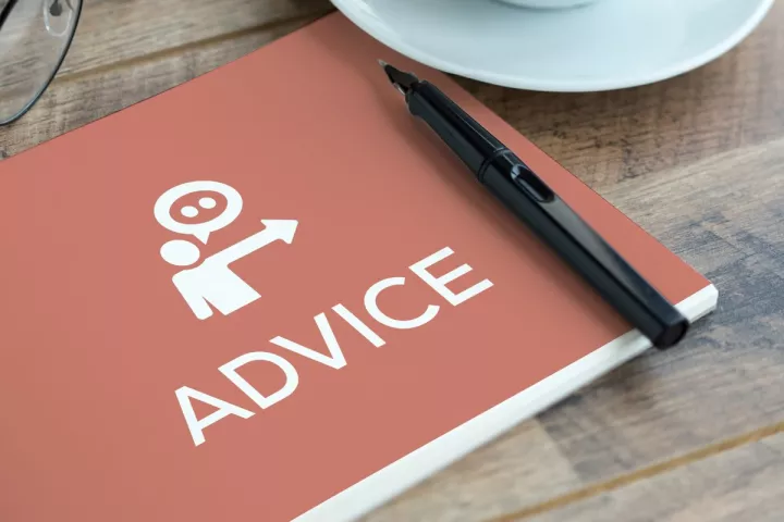 Advice book and coffee cup on table