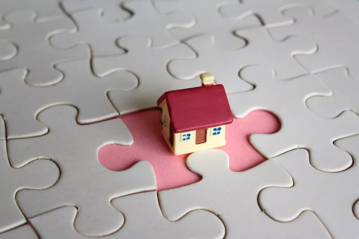 Jigsaw puzzle with a house