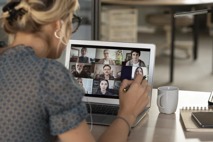 Woman at computer joining online session