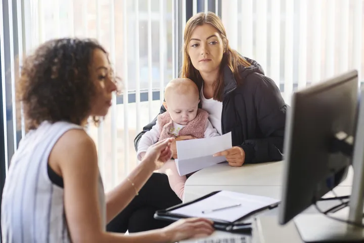 Young mother with support worker stock photo