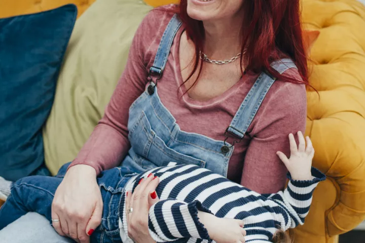 mother and child on sofa happy