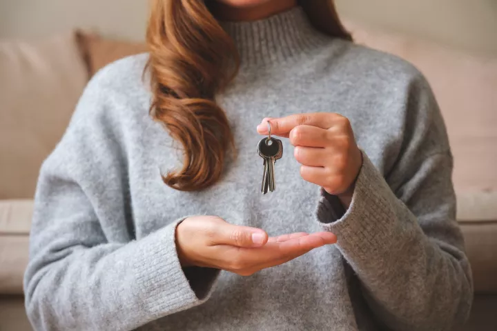 Woman holding key