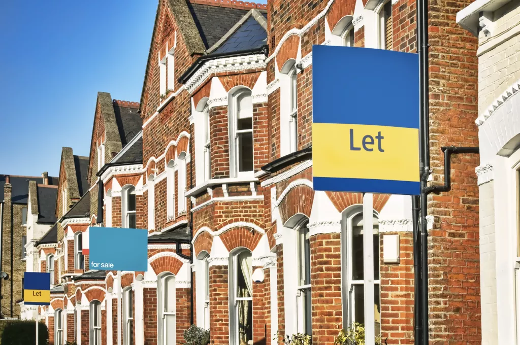 row of houses with let signs